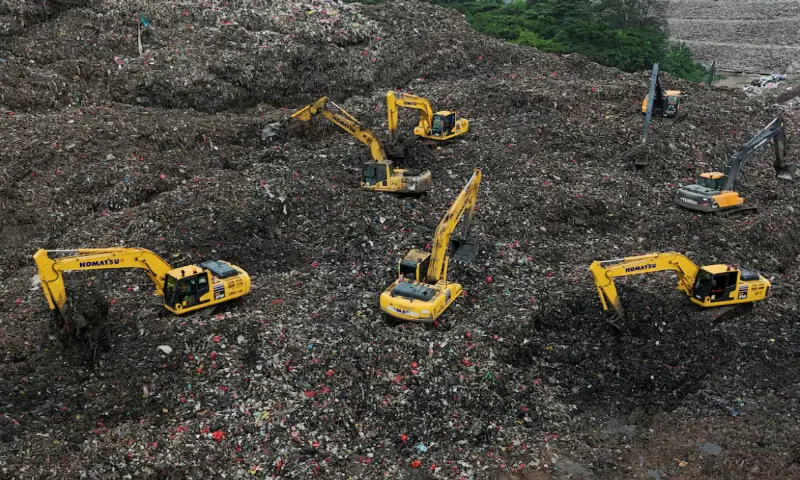 A drone view shows excavators operating amid garbage at the site of collapse at the Bantar Gebang landfill during a rescue operation in Bekasi, on the outskirts of Jakarta, Indonesia. &ndash; Reuters