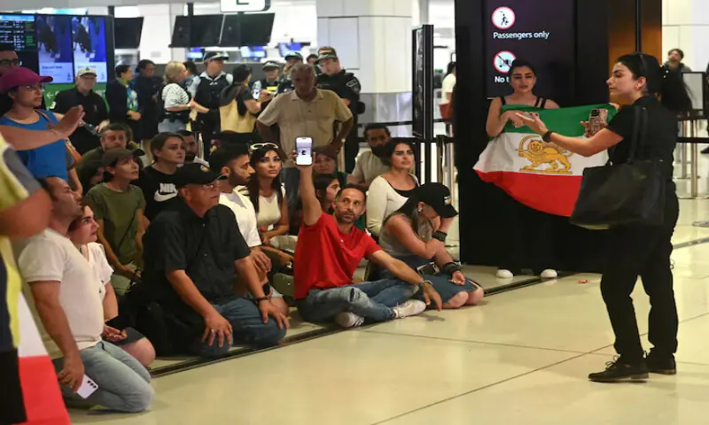 Supporters of the Iranian women&rsquo;s soccer team gather at Sydney Airport, after five of the players were granted asylum, in Sydney, Australia. &ndash; Reuters