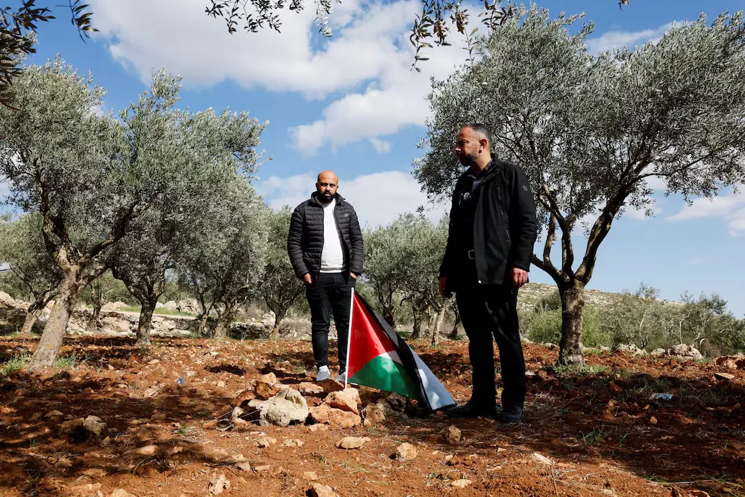 Mousa and Omar Hamayel, both 39, stand near bloodstains at the site where Thaer Hamayel was killed during an attack by Israeli settlers on the Palestinians in the village of Abu Falah near Ramallah, in the Israeli-occupied West Bank. &ndash; Reuters