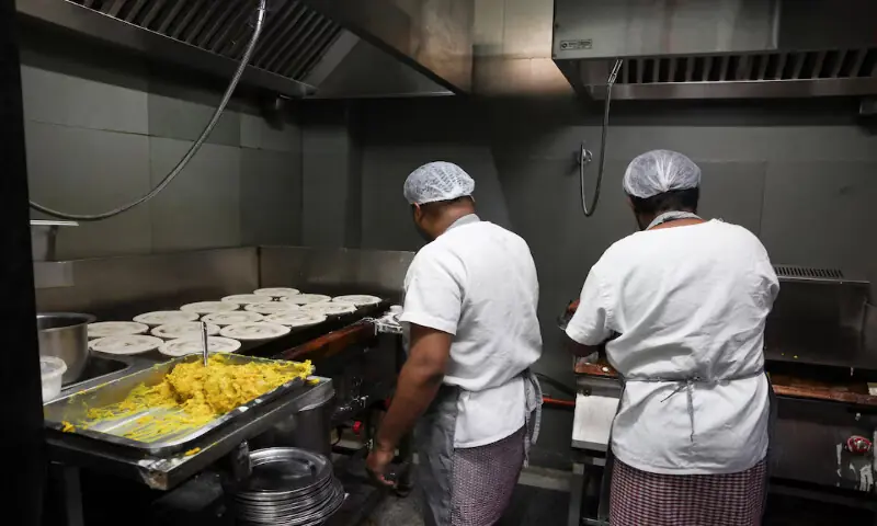 Workers make dosa inside the kitchen of a restaurant in Bengaluru, India. &ndash; Reuters