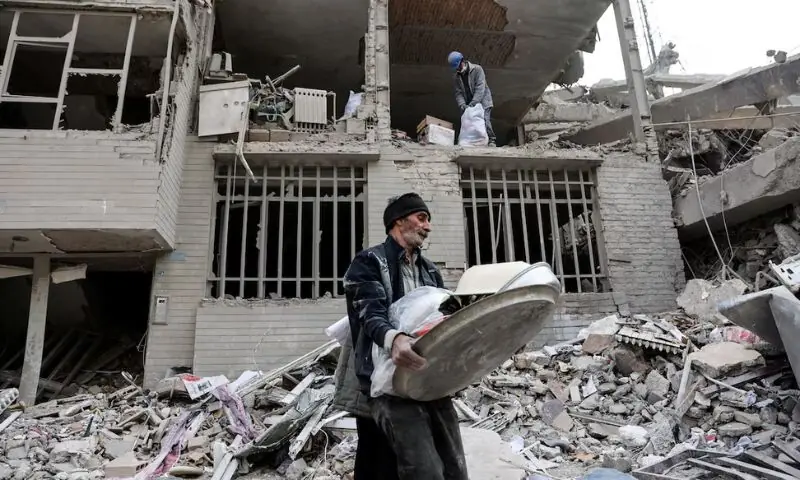 A man walks amid rubble in the aftermath of a strike, amid the U.S.-Israeli conflict with Iran, in Tehran, Iran. &ndash; Reuters
