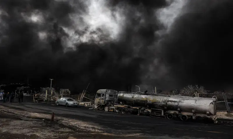 Smoke rises after a reported strike on Shahran fuel tanks in Tehran, Iran. &ndash; Reuters