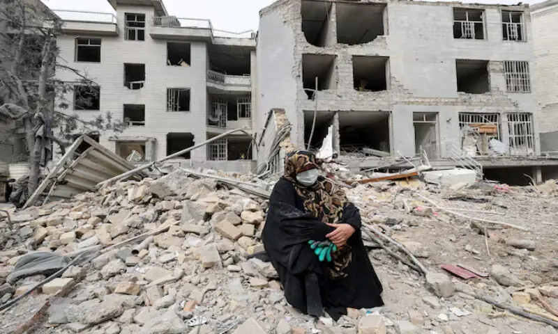 A woman sits outside her destroyed apartment after it was damaged in an air strike by the US-Israeli forces while she was inside in Tehran, Iran. – Reuters A woman sits outside her destroyed apartment after it was damaged in an air strike by the US-Israeli forces while she was inside in Tehran, Iran. – Reuters