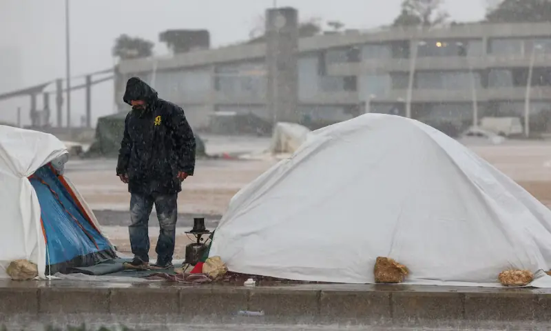 A displaced man stands next to tents during rainfall following Israeli strikes in Beirut, Lebanon, on Sunday. – Reuters A displaced man stands next to tents during rainfall following Israeli strikes in Beirut, Lebanon, on Sunday. – Reuters