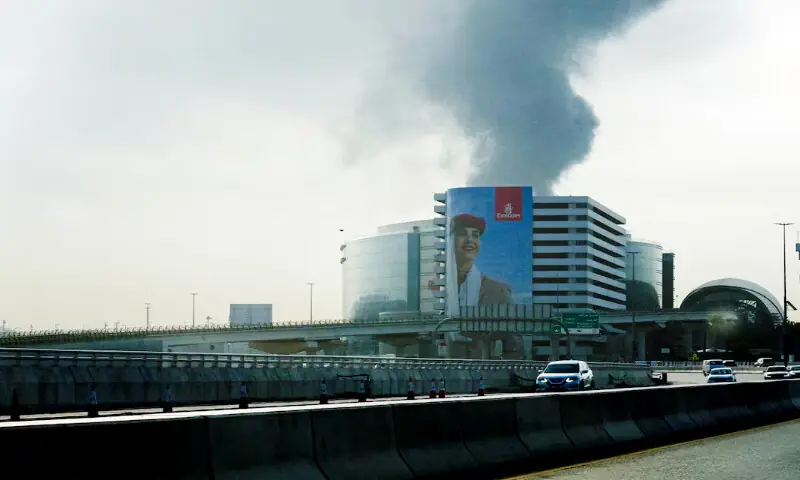 Smoke rising from an area near the Dubai International Airport is seen through the windshield of a vehicle, after a drone attack hit a fuel tank, according to Dubai authorities in Dubai, United Arab Emirates, on Monday. &ndash; Reuters