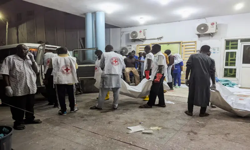 Members of the Nigerian Red Cross carry body bags containing casualties at a Maiduguri hospital following explosions that struck the northeastern city of Maiduguri, Borno State, Nigeria. &ndash; Reuters