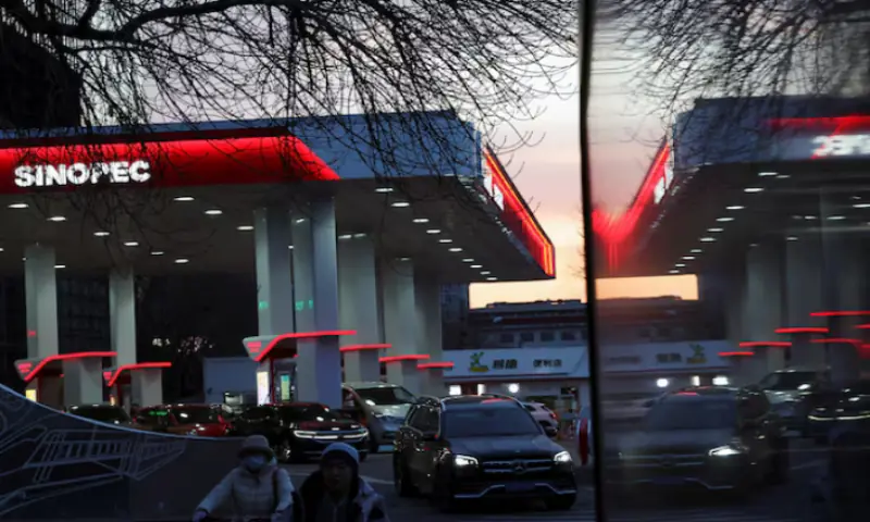 A car leaves a Sinopec gas station in Beijing, China. &ndash; Reuters