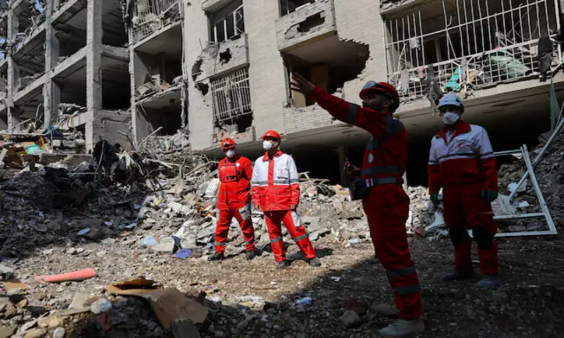Members of a Red Crescent rescue team work at a building that was damaged in an Israeli strike in Tehran, Iran. &ndash; Reuters