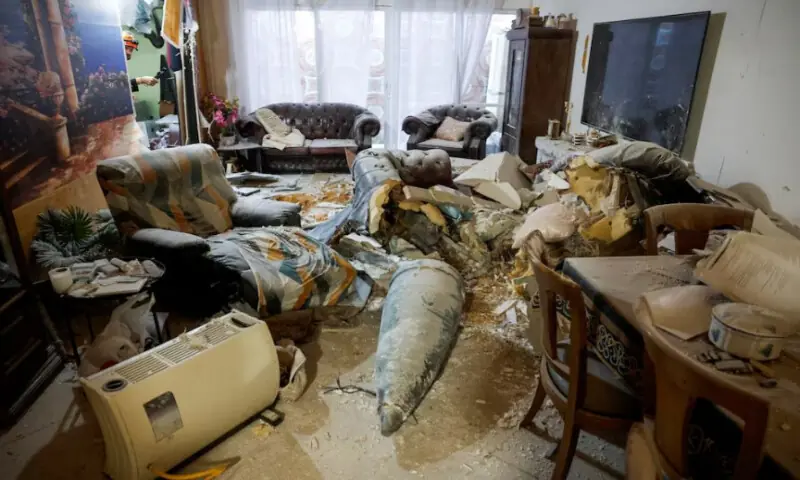 Part of an Iranian missile in a living room, after Iran launched barrages of missiles towards Israel, amid the U.S.-Israel conflict with Iran, in Rehovot, Israel, on March 20, 2026. Reuters