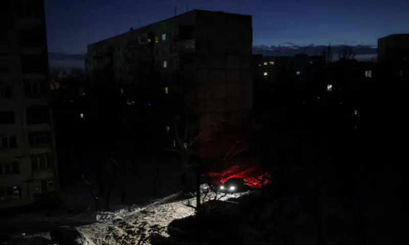 A car drives on a street during a power blackout after critical civil infrastructure was hit by recent Russian missile and drone attacks, amid Russia&rsquo;s attack on Ukraine, in Chernihiv, Ukraine. &ndash; Reuters