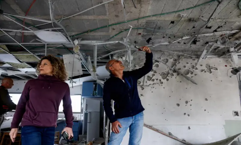 Municipality officials inspect the damage inside a kindergarten at an impact site, following a barrage of missiles launched from Iran, amid the U.S.-Israeli conflict with Iran, in Rishon Lezion, Israel, on March 21, 2026. Reuters