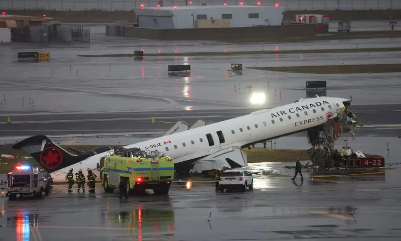 Debris hangs from a damaged Air Canada Express jet that had collided with a ground vehicle at New York&rsquo;s LaGuardia Airport in Queens on Monday. &ndash; Reuters