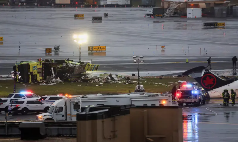 Emergency services work at the scene after an Air Canada Express jet collided with a ground vehicle at New York&rsquo;s LaGuardia Airport in Queens, New York, on Monday. &ndash; Reuters