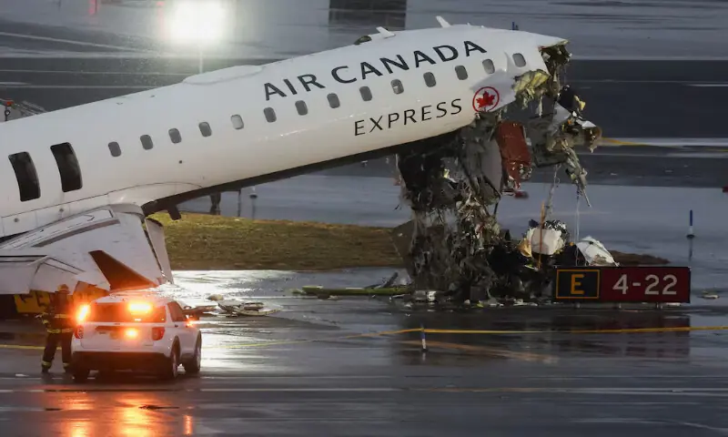 Debris hangs from a damaged Air Canada Express jet that had collided with a ground vehicle at New York&rsquo;s LaGuardia Airport in Queens, New York, on Monday. &ndash; Reuters