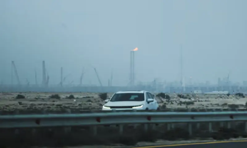 A car passes near QatarEnergy&rsquo;s liquefied natural gas (LNG) production facilities, amid the US-Israeli conflict with Iran, in Ras Laffan Industrial City, Qatar. &ndash; rEUTERS