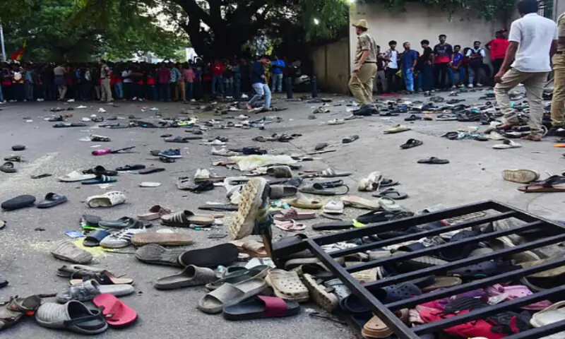 Fans stand next to abandoned shoes and a fallen barrier following a stampede during celebrations, a day after Royal Challengers Bengaluru&rsquo;s victory at the IPL Twenty20 final cricket match, outside the M. Chinnaswamy Stadium in Bengaluru on June 4. AFP