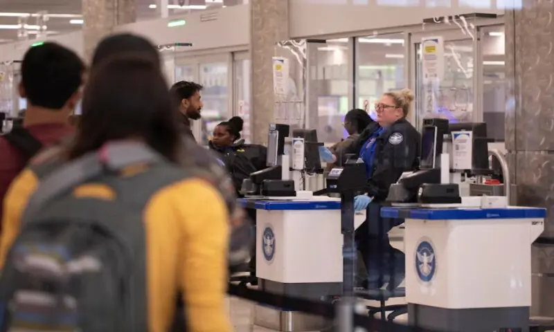A Transportation Security Administration officer checks passengers as they travel through a TSA security screening checkpoint at Hartsfield-Jackson Atlanta International Airport in Atlanta, Georgia, U.S. on March 24, 2026. Reuters