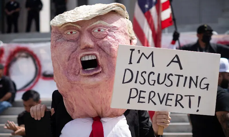 A demonstrator holds a sign during a &ldquo;No Kings&rdquo; protest against US President Donald Trump&rsquo;s policies, in Los Angeles, California. &ndash; Reuters