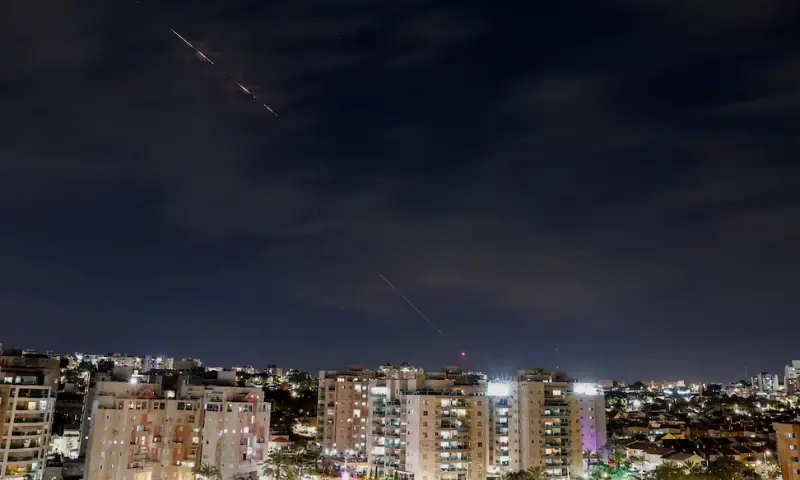 Streaks of light illuminate the sky during an interception attempt, amid the U.S.-Israeli conflict with Iran, as seen from Ashkelon, Israel. &ndash; Reuters