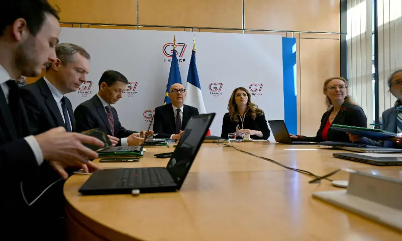 France&rsquo;s Economy and Finance Minister Roland Lescure (C-L) and France&rsquo;s Government Spokesperson and Energy Minister Maud Bregeon (C-R) sit moments before hosting a videoconference with the G7 energy and finance ministers with central banks representatives at the French Economy minister in Paris on March 30, 2026. AFP
