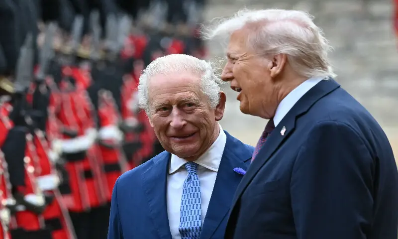 Britain&rsquo;s King Charles III (left) and US President Donald Trump talk as they inspect a guard of honour during a ceremonial welcome in the Quadrangle at Windsor Castle, in Windsor, on September 17, 2025, during the US president&rsquo;s second State Visit. AFP file
