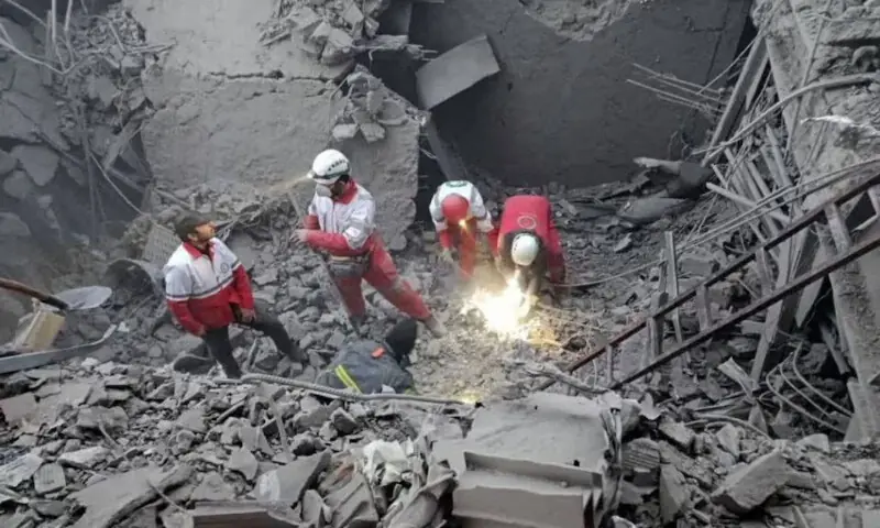 Members of the Iranian Red Crescent Society work at the site of a strike near Hosseinieh Azam Zanjan Mosque in Zanjan, Iran. &ndash; Reuters