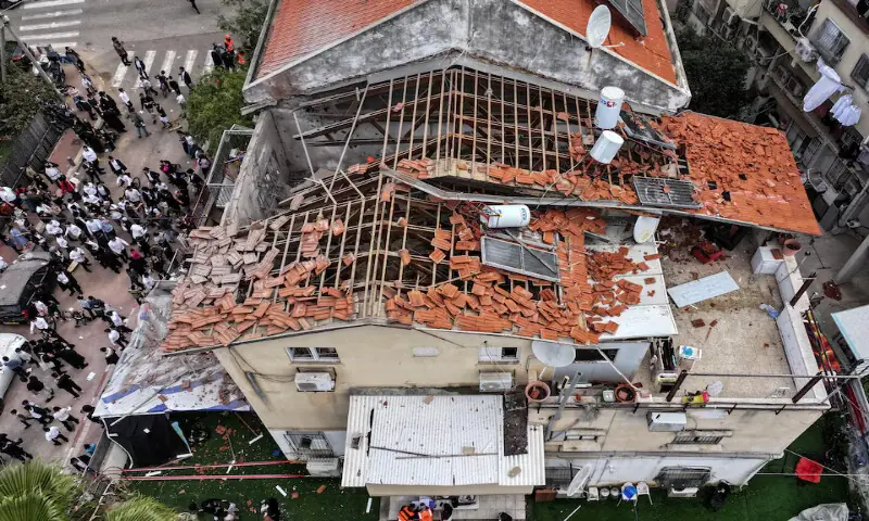 A drone view of people gathering at the site of damage in a residential neighbourhood following Iranian missile barrages in central Israel in Bnei Brak, Israel. &ndash; Reuters