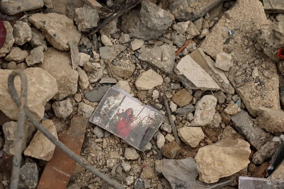 A photo lying among the rubble of a house destroyed by an Israeli strike, amid escalating hostilities between Israel and Hezbollah, as the US-Israel conflict with Iran continues, in Houmine El Tahta, Lebanon. &ndash; Reuters