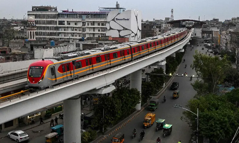 A metro train glides along an elevated track in Lahore on April 3, 2026.