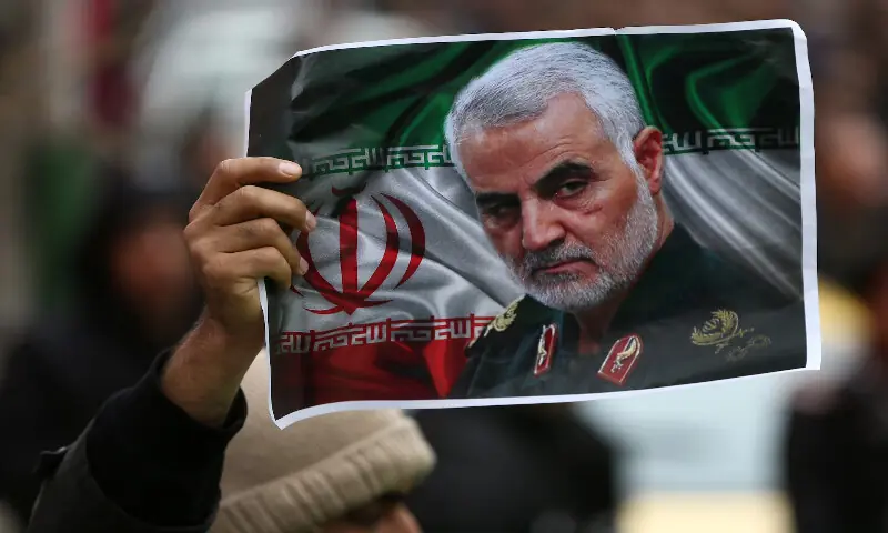 An Iranian holds a picture of late General Qassem Soleimani as people gather to mourn him in Tehran. Reuters file An Iranian holds a picture of late General Qassem Soleimani as people gather to mourn him in Tehran. Reuters file