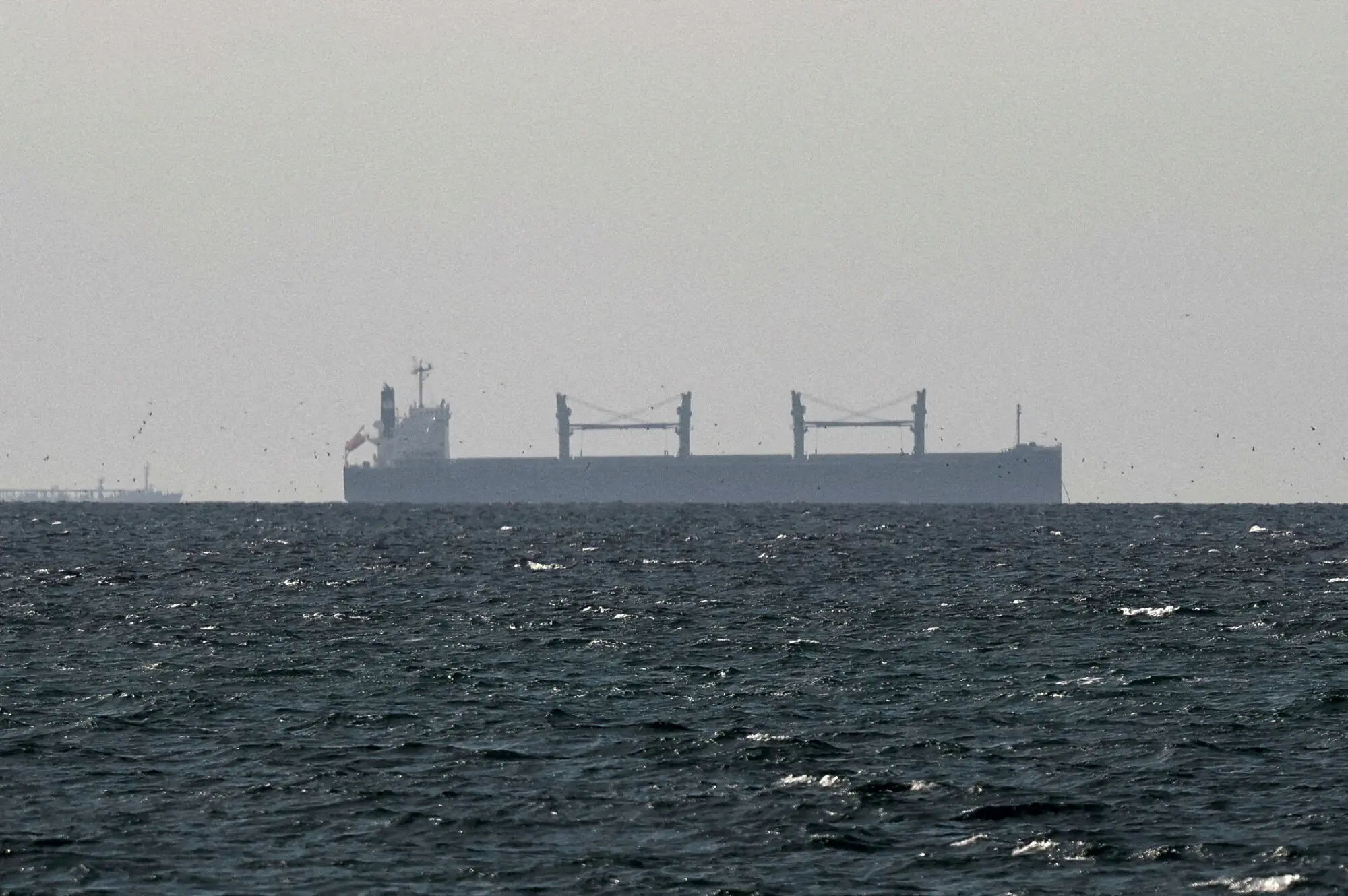 Cargo ship in the Gulf, near the Strait of Hormuz, near the border with Oman&rsquo;s Musandam governance. &ndash; Reuters