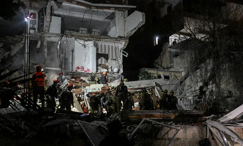 First responders work at the site of a projectile impact following an Iranian strike in northern Israel. – Reuters First responders work at the site of a projectile impact following an Iranian strike in northern Israel. – Reuters