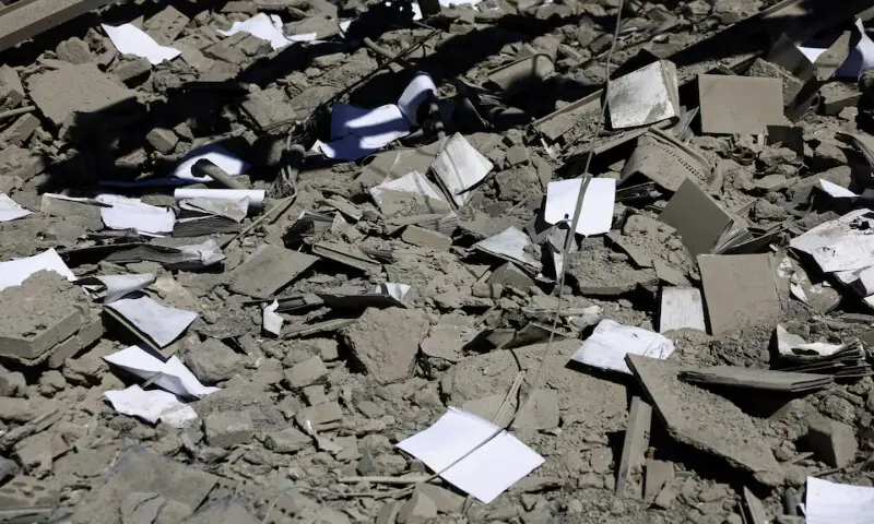 Books and papers lie scattered amidst the rubble of a building of the Sharif University of Technology, which was damaged in a strike, amid the US-Israeli conflict with Iran, in Tehran on April 7, 2026. Reuters