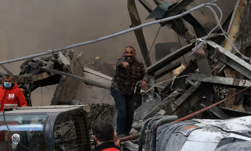 A man gestures as rescuers work at the site of an Israeli strike in Beirut, Lebanon. &ndash; Reuters