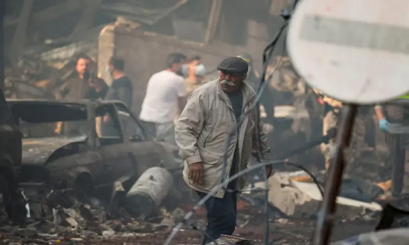 A man walks at the site of an Israeli strike in Al Mazraa in Beirut, Lebanon. &ndash; Reuters