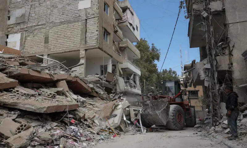 A bulldozer works at the site of Israeli strike in Tyre, Lebanon. &ndash; Reuters