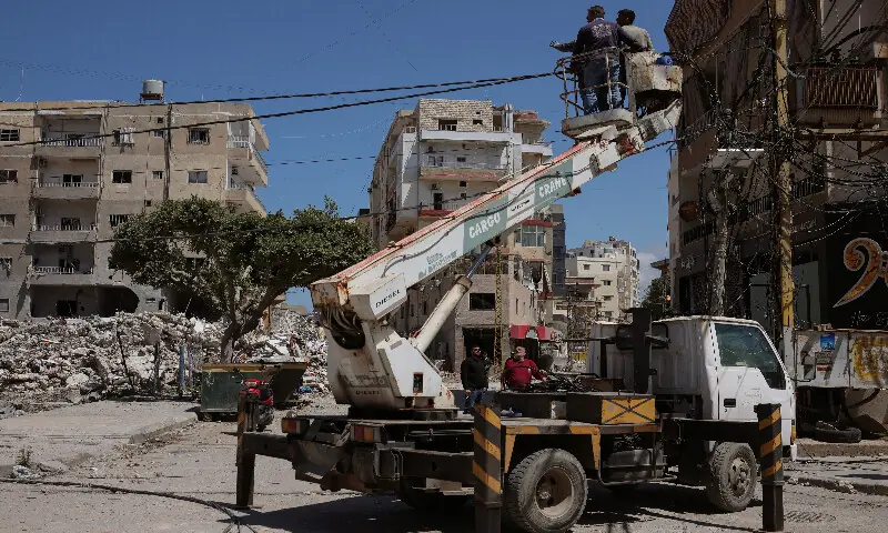 Workers repair electricity infrastructure, damaged during Israeli strikes in south Lebanon. – Reuters Workers repair electricity infrastructure, damaged during Israeli strikes in south Lebanon. – Reuters