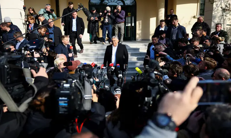 Hungarian Prime Minister Viktor Orban walks to talk to journalists after casting his vote during the Hungarian parliamentary election in Budapest, Hungary, on Sunday. &ndash; Reuters
