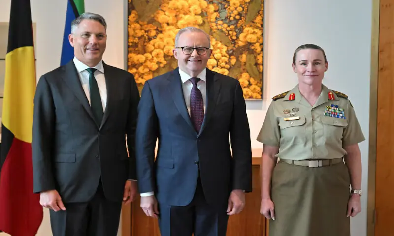 Deputy Prime Minister Richard Marles, Prime Minister Anthony Albanese and newly appointed Chief of Army Lieutenant General Susan Coyle pose for photographers in Canberra, Australia, on Monday. &ndash; Reuters