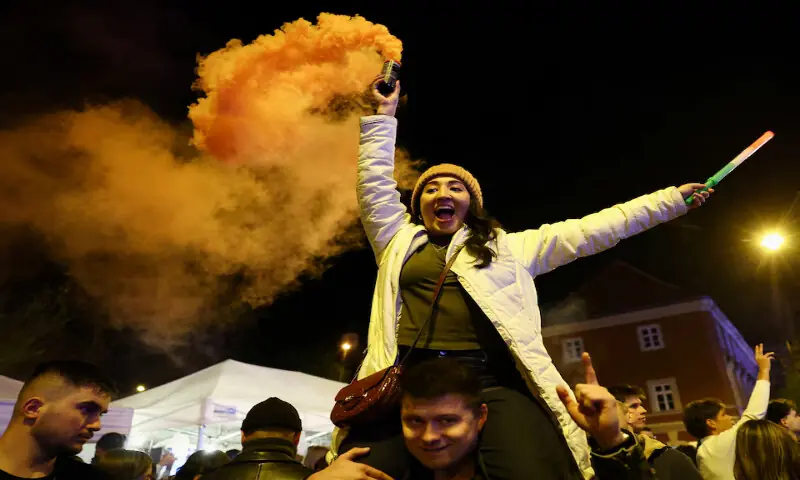 People celebrate following partial results on the day of the Hungarian Parliamentary election in Budapest, Hungary, on Monday. – Reuters People celebrate following partial results on the day of the Hungarian Parliamentary election in Budapest, Hungary, on Monday. – Reuters
