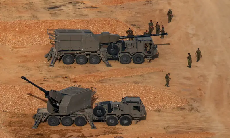 Israeli soldiers next to artillery vehicles near the Israel-Lebanon border, in northern Israel. – Reuters Israeli soldiers next to artillery vehicles near the Israel-Lebanon border, in northern Israel. – Reuters