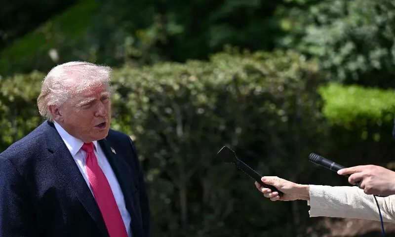 US President Donald Trump speaks to reporters before walking to board Marine One as he departs from the South Lawn of the White House in Washington, DC, on April 16, 2026. AFP
