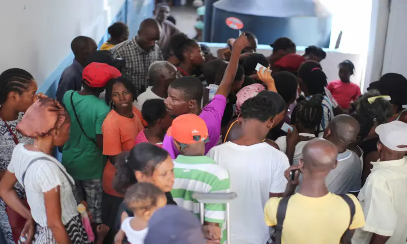 People gather to receive food at the temporary shelter in College des Antilles as the country faces emergency food insecurity while immersed in a social and political crisis, in Port-au-Prince, Haiti. &ndash; Reuters