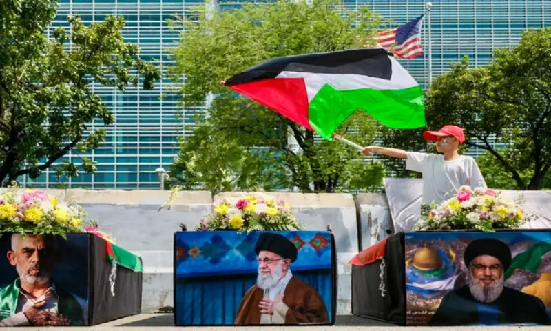 A boy waves a Palestinian flag next to mock coffins during the International Quds Day commemoration in front of the US Embassy in Jakarta, Indonesia. &ndash; Courtesy X