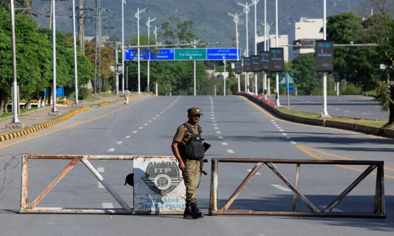 An army soldier stands guard on a road leading to Serena hotel, the venue for the second phase of peace talks between the United States and Iran in Islamabad. &ndash; Reuters