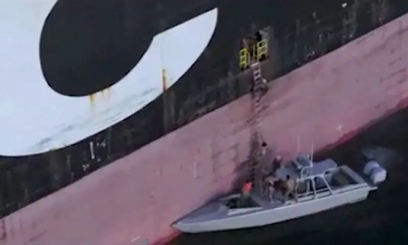 This screen grab taken from undated video footage released by Iran's Revolutionary Guards and made available via Iran's state broadcaster on April 23, 2026, shows IRGC naval forces allegedly boarding a ship attempting to cross the Strait of Hormuz. AFP