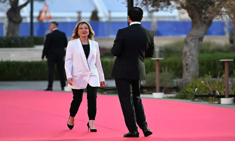 Cyprus' President Nikos Christodoulides (right) welcomes Italy's Prime Minister Giorgia Meloni upon the latter's arrival ahead of an informal meeting of the European Council, in Ayia Napa on April 23, 2026. AFP