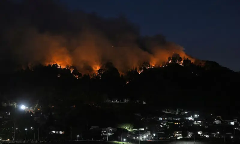 A wildfire burns near the Kirikiri district of Otsuchi, Iwate Prefecture, Japan. -- Reuters