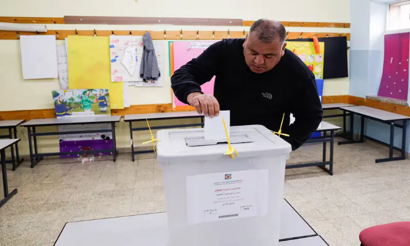 A Palestinian man votes during the municipal council election in Al Bireh, in the Israeli-occupied West Bank, on Saturday. -- Reuters