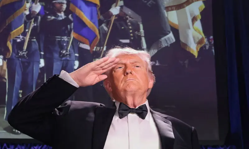 US President Donald Trump salutes during the annual White House Correspondents' Association dinner in Washington, DC. -- Reuters
